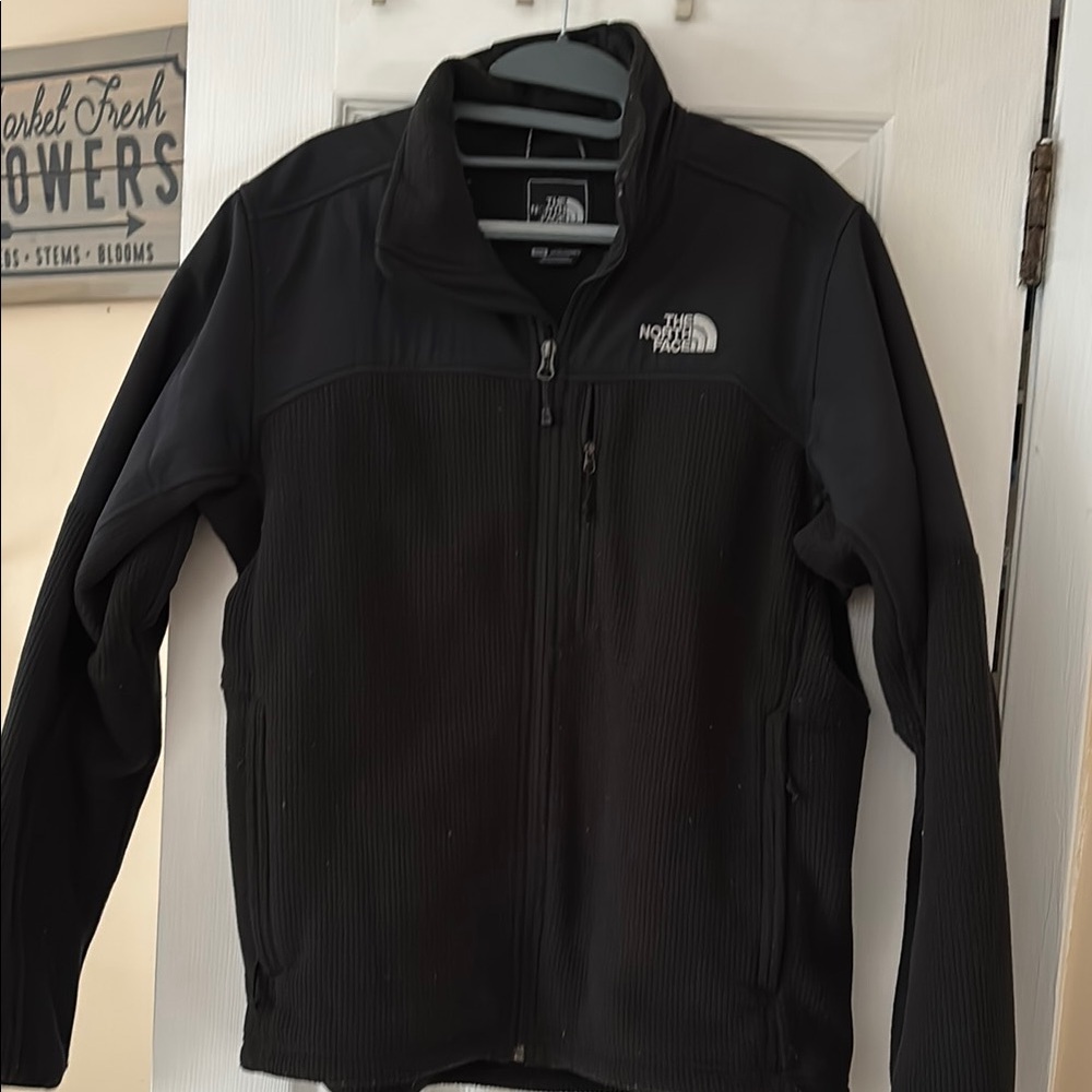 The North Face Men's Black Jacket used but good condition room. Some pilling